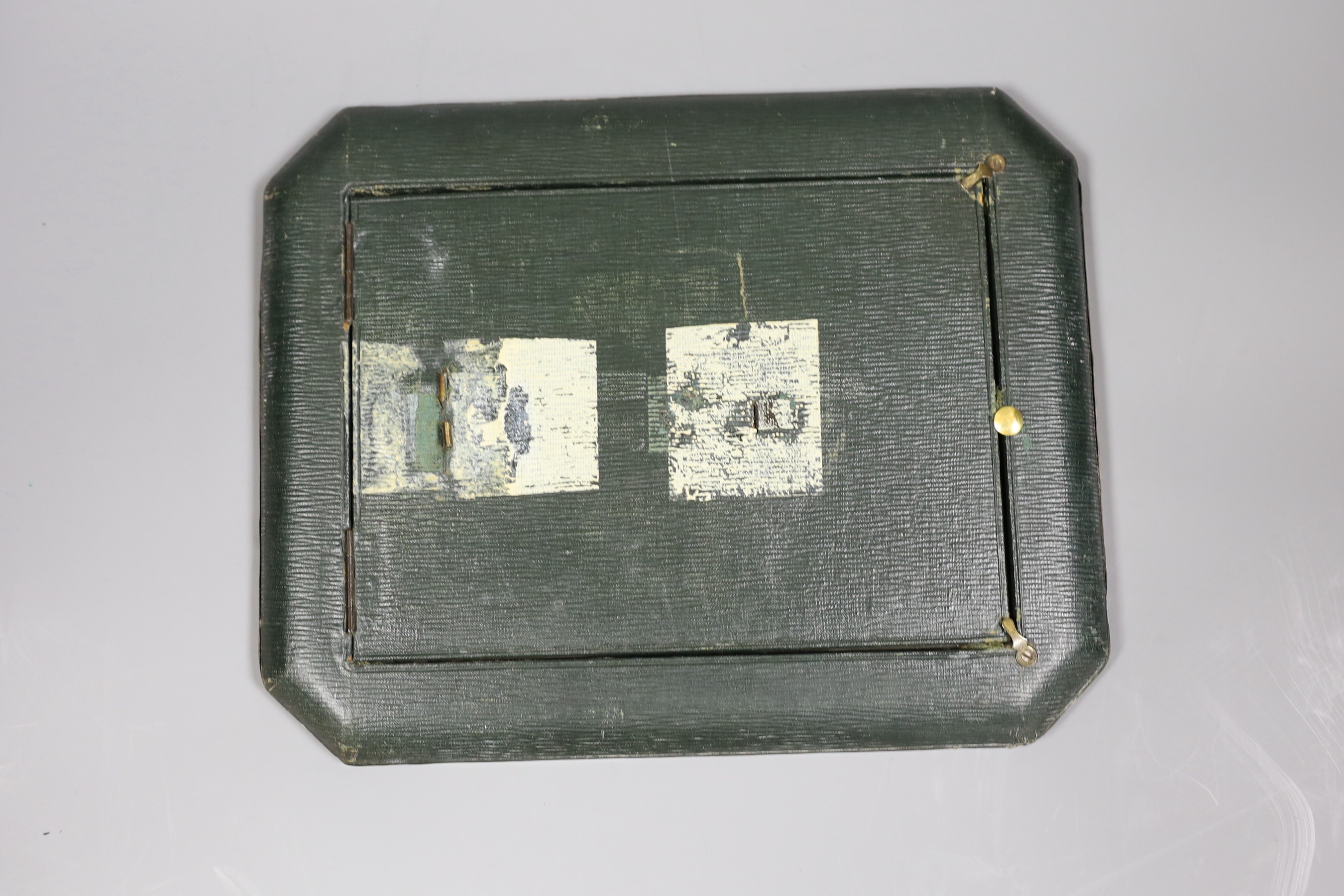 A George V planished silver mounted rectangular photograph frame, with canted corners, Synyer & Beddoes, Birmingham, 1911, 28.1cm, (lacks support arm).